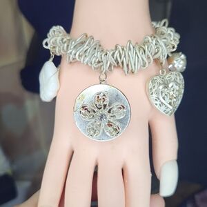 Silvertone charm bracelet locket